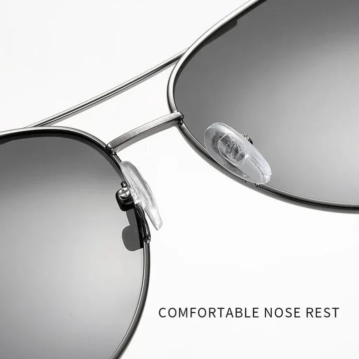 Photochromic Pilot Sunglasses with silver lenses that adjust tint based on light conditions