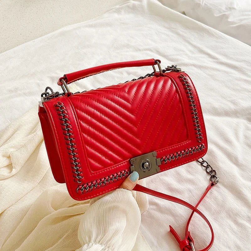 Fashionable leather messenger bag with chain strap in a range of vibrant colours, designed for style and functionality