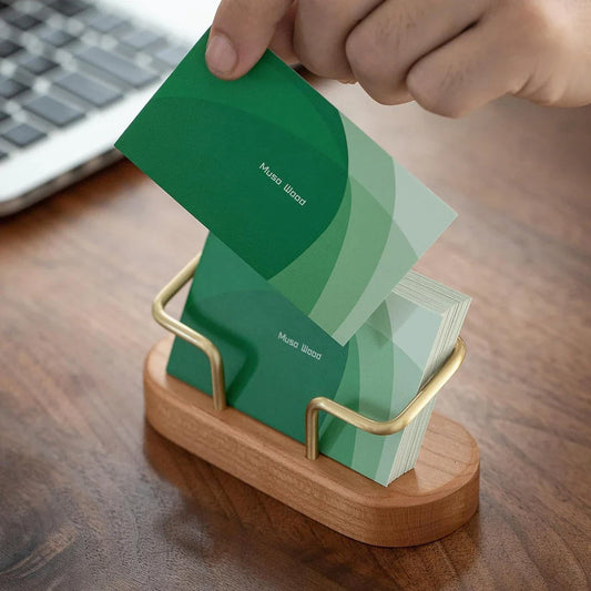 Elegant wooden business card holder made of premium black walnut or beech wood, designed for use on office desks and in home workspaces.