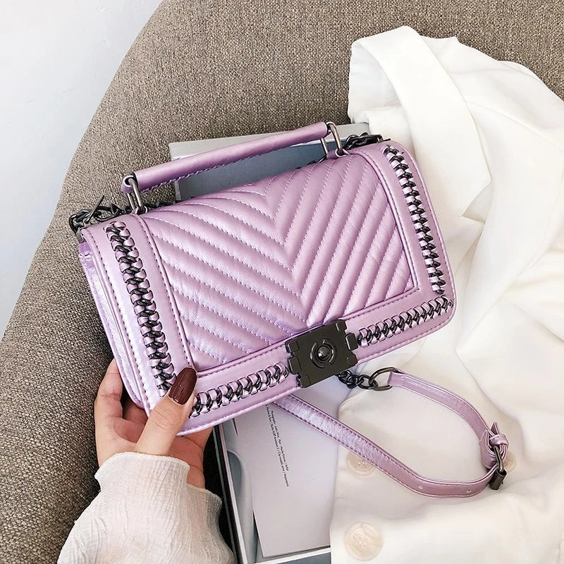Fashionable leather messenger bag with chain strap in a range of vibrant colours, designed for style and functionality