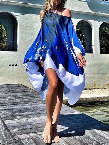 A chic inclined shoulder printed dress in a vibrant colour with a large, swinging skirt