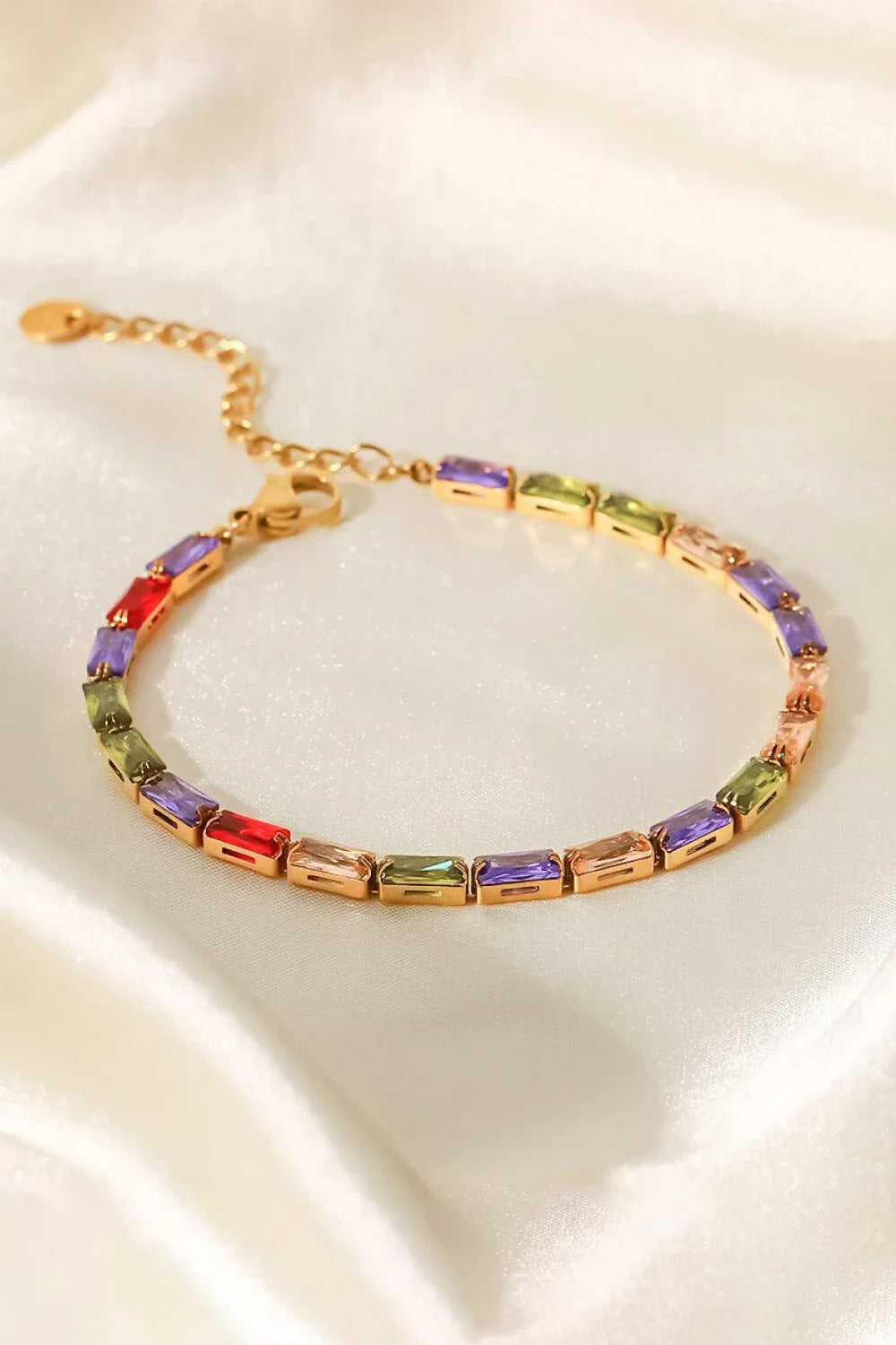 Elegant 18K gold plated bracelet with multicoloured cubic zirconia stones, a versatile accessory that adds a touch of sparkle to any outfit.
