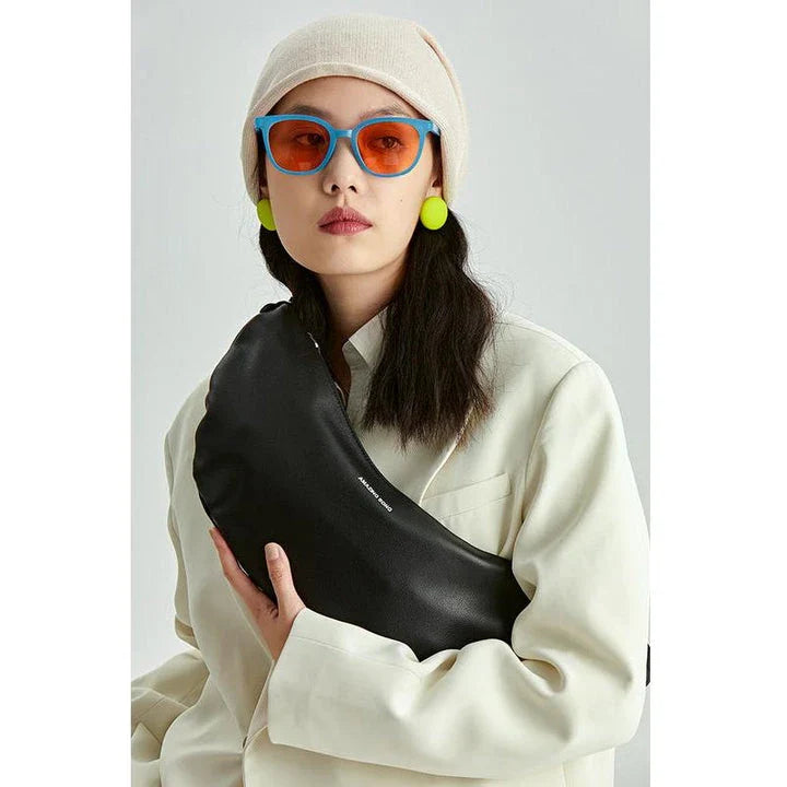 Stylish leather crossbody fanny pack with vintage half-moon design, perfect for everyday use in the UK