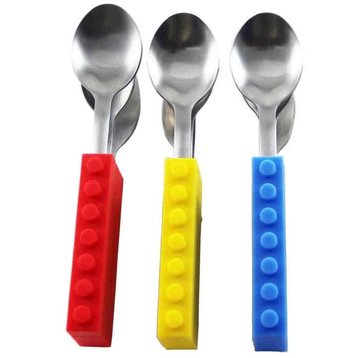 A colourful cutlery set with a decorative brick pattern, made of durable metal and featuring a knife, fork, and spoon.