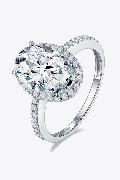 Elegant 4.5 carat moissanite halo ring in sterling silver with platinum plating, showcasing a captivating centre stone and delicate gem-studded design