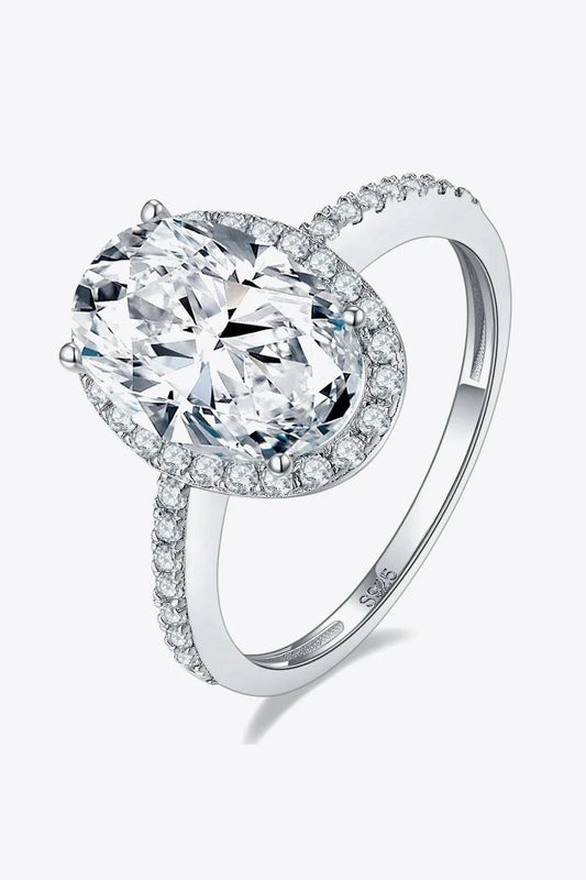 Elegant 4.5 carat moissanite halo ring in sterling silver with platinum plating, showcasing a captivating centre stone and delicate gem-studded design