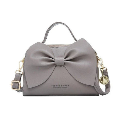 Elegant brown Korean-inspired bow shoulder bag with adjustable strap and roomy interior