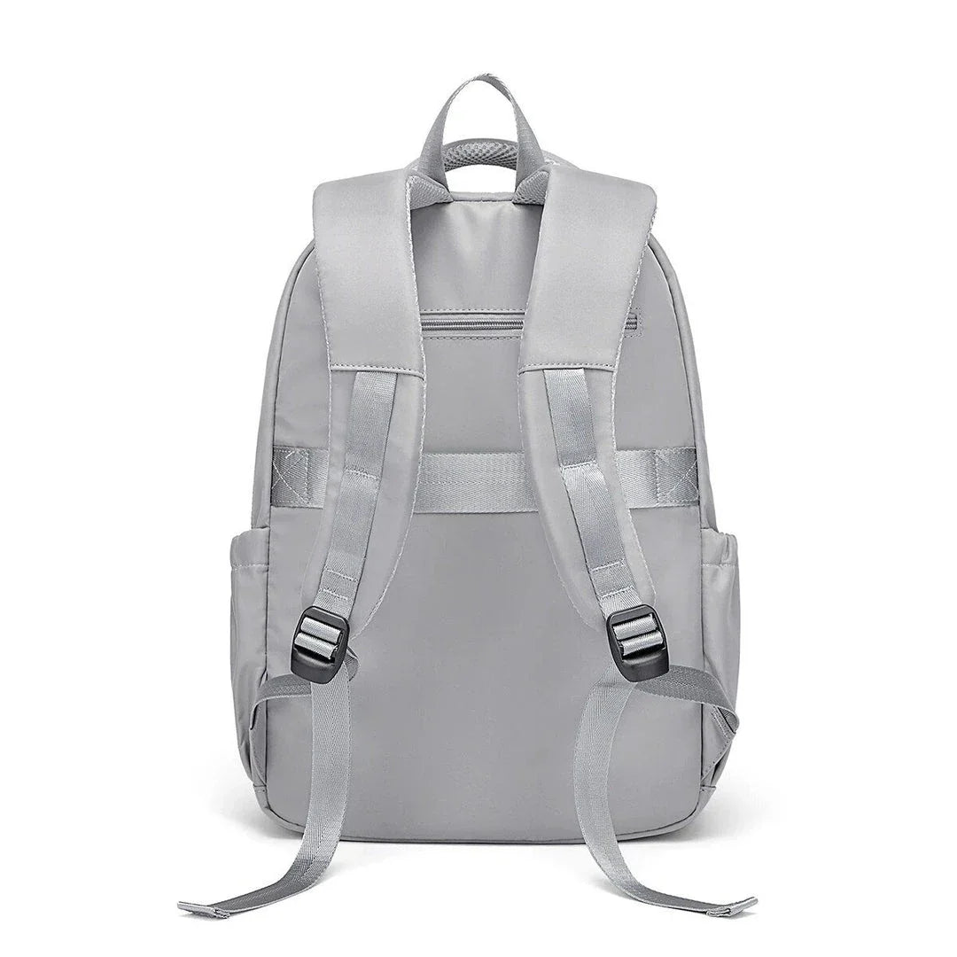 Premium leather backpack with dedicated laptop compartment, soft handles, and arcuate shoulder straps for modern women