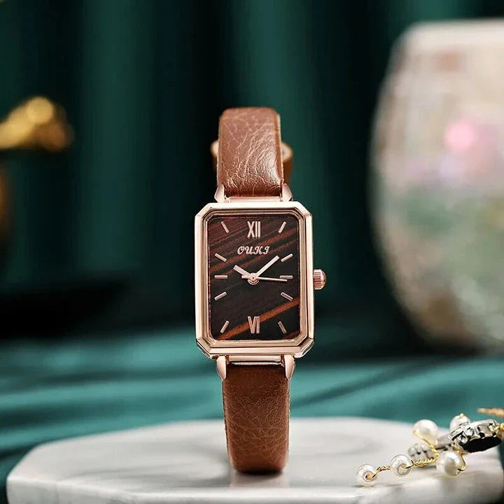 Refined square dial ladies watch with genuine leather strap, minimalist design, and durable aluminium alloy case