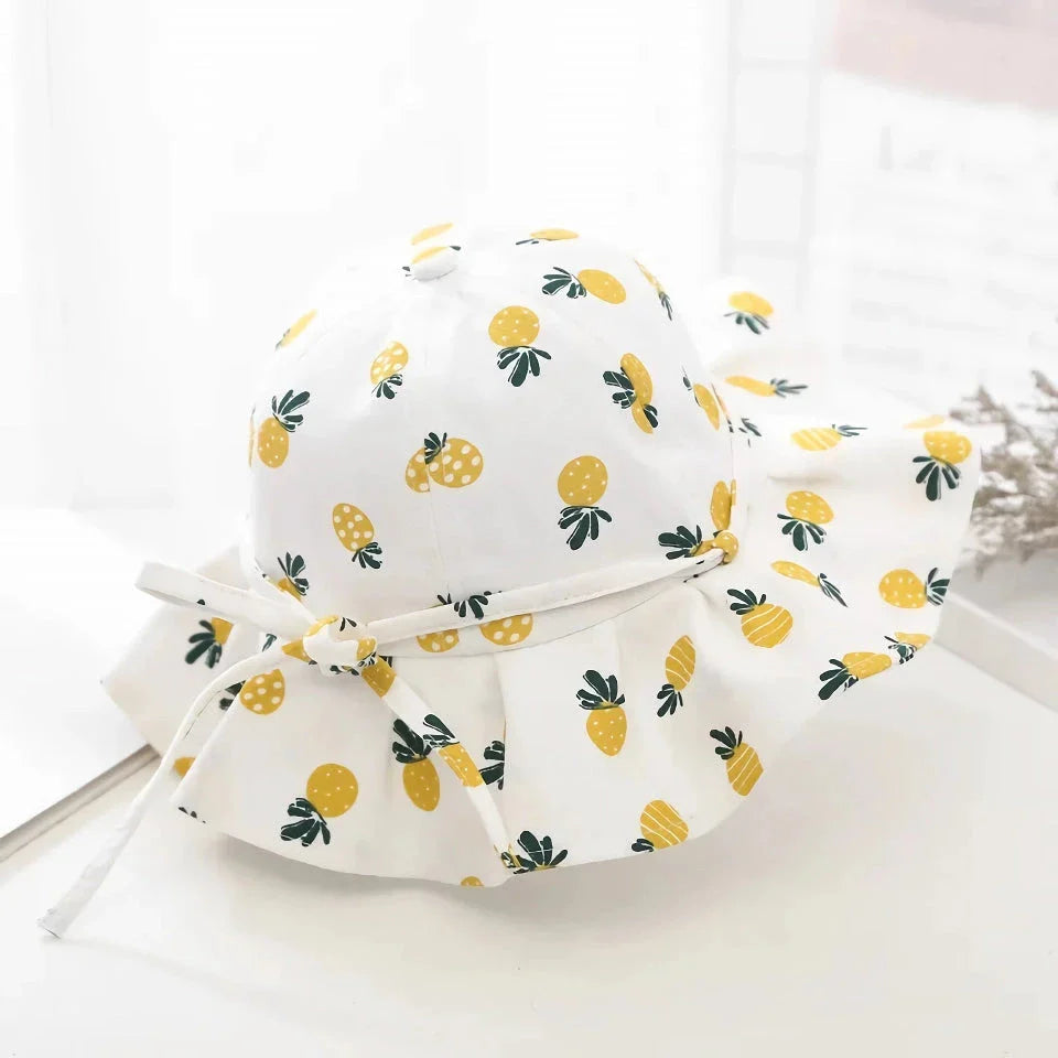 Adjustable white cotton sun protection bucket hat with cartoon pattern for children