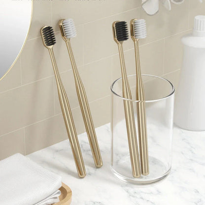 Elegant gold and silver toothbrush with soft bristles for superior dental hygiene