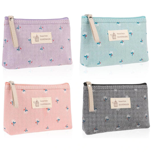 A stylish floral canvas cosmetic bag with a secure zipper closure, perfect for organising and carrying your makeup and toiletries while traveling.