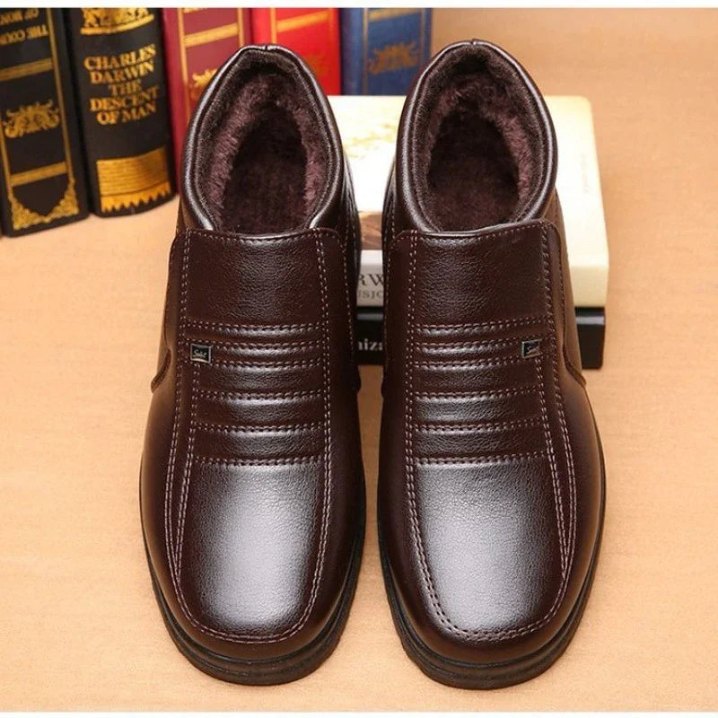 Premium cotton leather men's ankle boots in black and brown, featuring plush lining and durable rubber sole for warmth and stability in cold weather