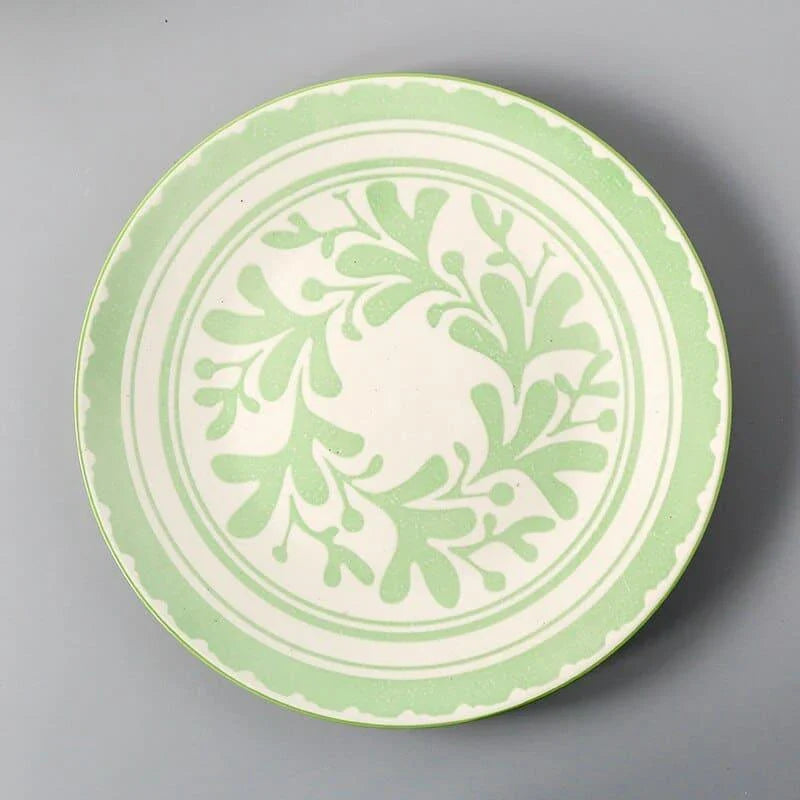 Elegant ceramic plates with vibrant, whimsical prints in a variety of enchanting designs