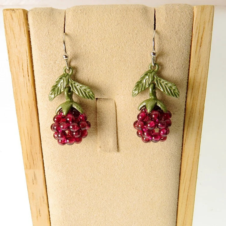 Vintage-style raspberry lacquer earrings with garnet accents, showcasing a charming fruit-shaped silhouette and a captivating retro-inspired design.