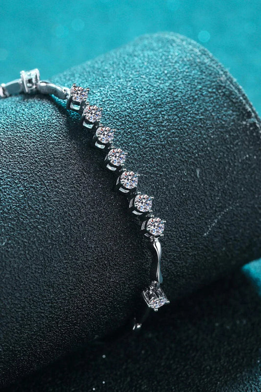 Elegant moissanite and sterling silver bracelet with a rhodium plated finish, designed for sophisticated style.
