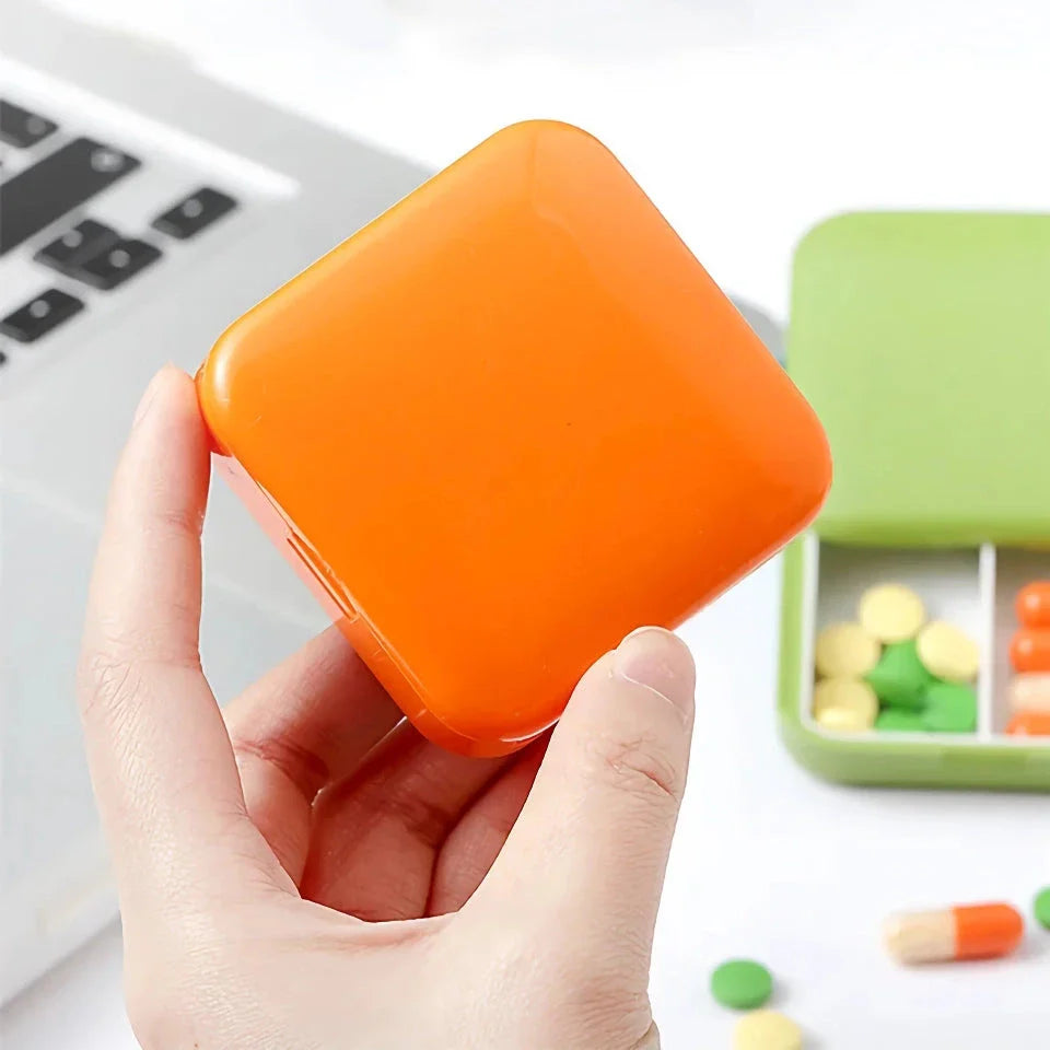 Compact push-pull pill case organiser in various vibrant cartoon-inspired colours for convenient medication management