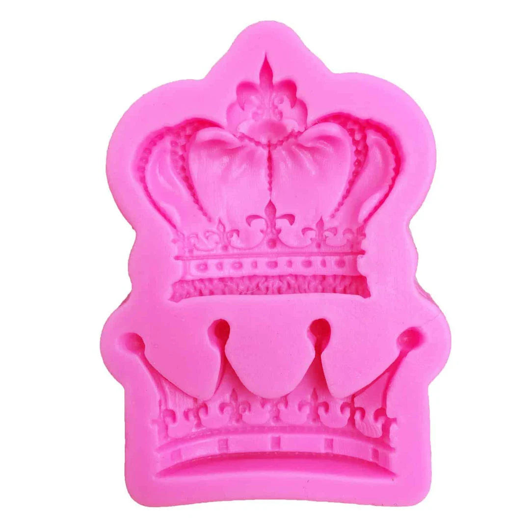 Elegant crown-shaped silicone fondant mould in vibrant pink colour for creating regal-inspired baked goods