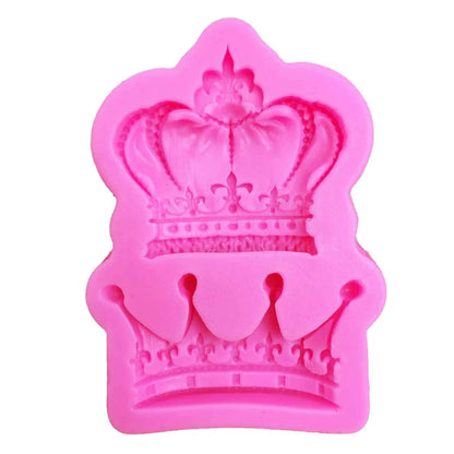 Elegant crown-shaped silicone fondant mould in vibrant pink colour for creating regal-inspired baked goods