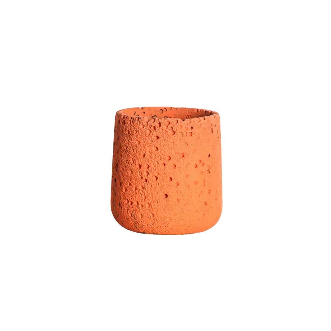 A modern, perforated cement bonsai planter in a Nordic-inspired design, available in various sizes and colours.