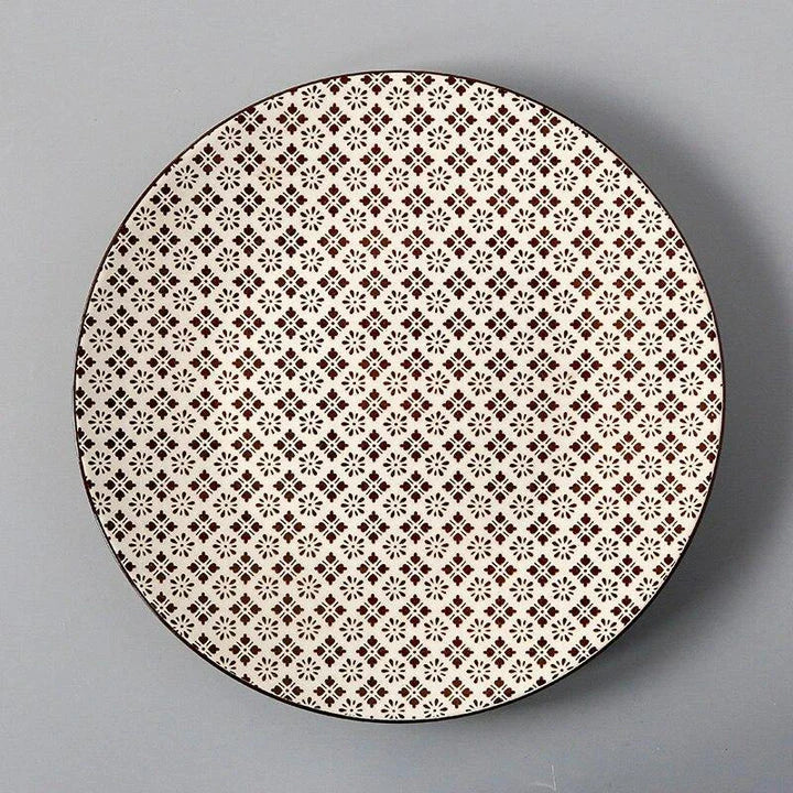 Elegant ceramic plates with vibrant, whimsical prints in a variety of enchanting designs