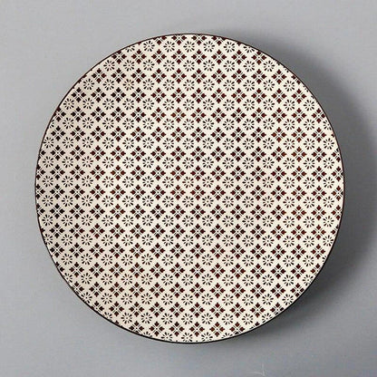 Elegant ceramic plates with vibrant, whimsical prints in a variety of enchanting designs