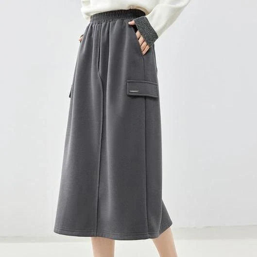 Elegant dark grey midi skirt with subtle sequin detailing, suitable for autumn and winter wear