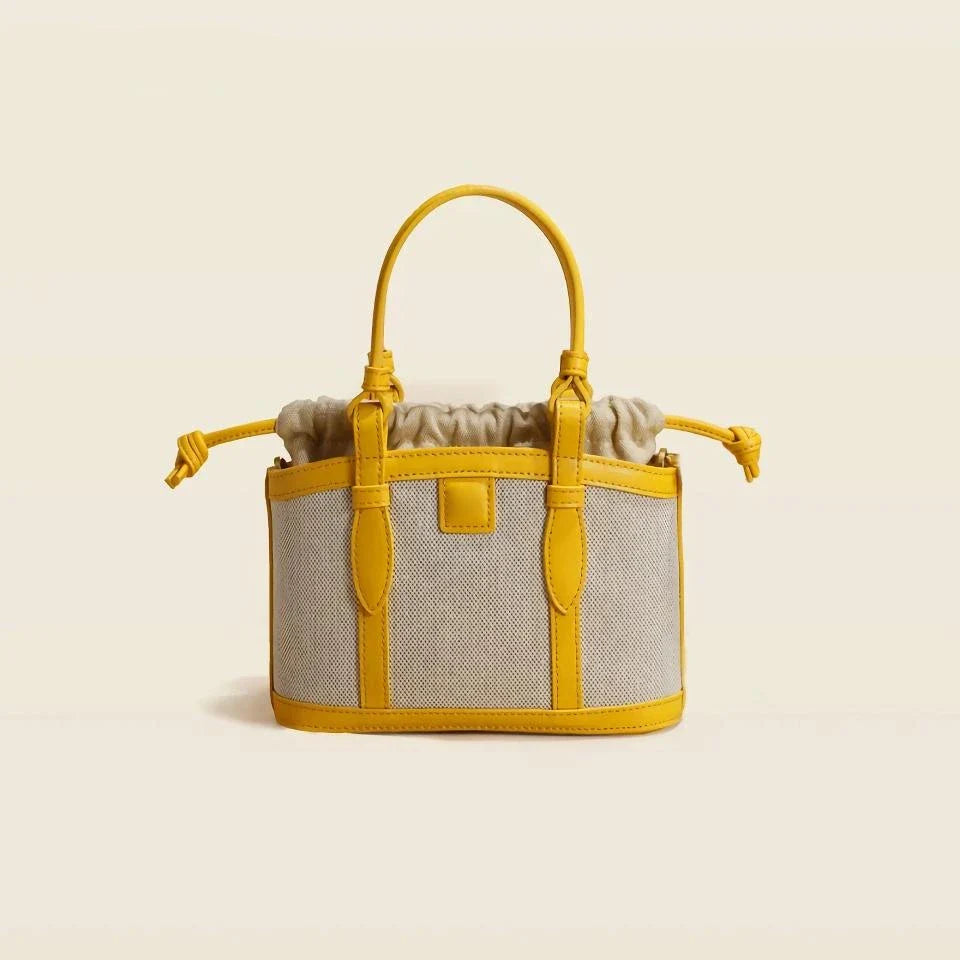 Refined genuine leather women's messenger bag in a stylish, square shape with a convenient string closure and adjustable shoulder strap.