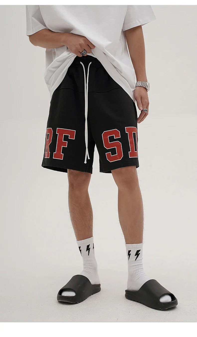 Premium loose-fit sports shorts with eye-catching printed patterns in black, khaki, and dark grey colours