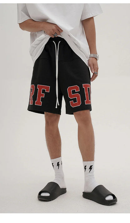 Premium loose-fit sports shorts with eye-catching printed patterns in black, khaki, and dark grey colours