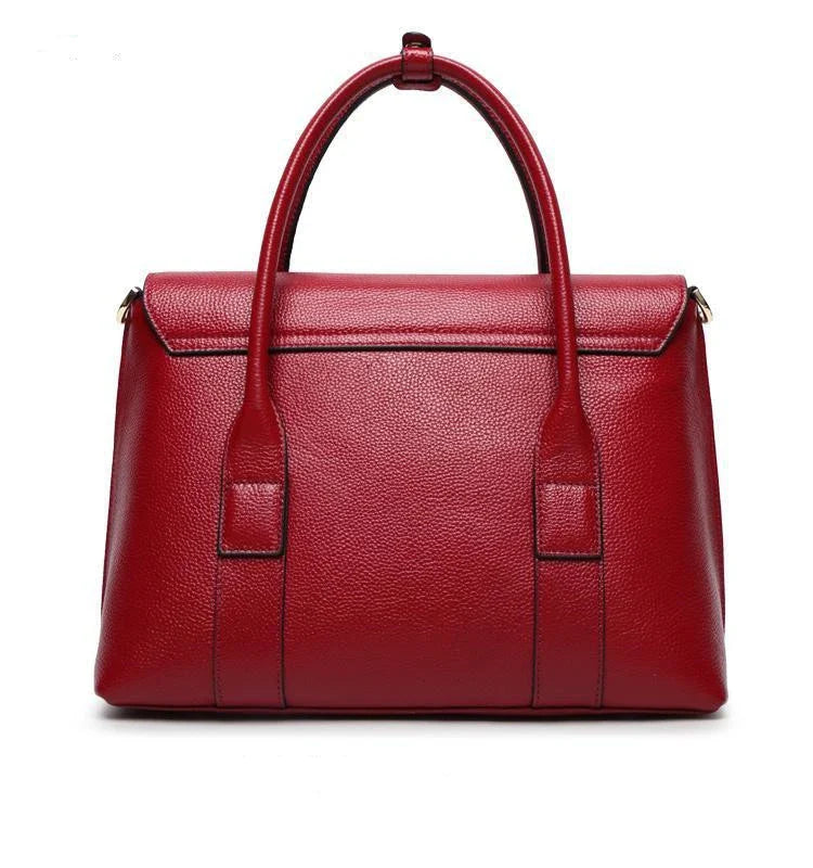 Premium first-layer cowhide leather shoulder bag with adjustable strap, spacious interior, and classic fashion design