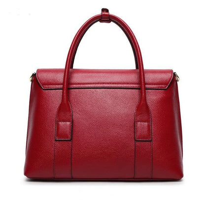 Premium first-layer cowhide leather shoulder bag with adjustable strap, spacious interior, and classic fashion design