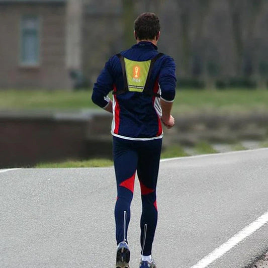 A grey LED signal vest with bright lights for improved visibility and safety during outdoor activities