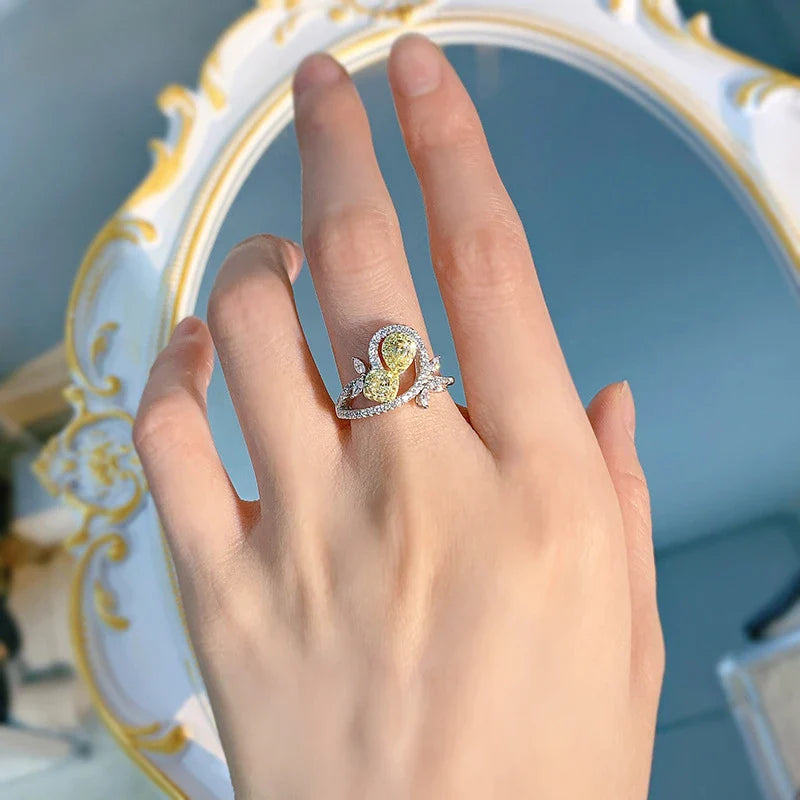 Elegant 925 sterling silver fashion ring with a yellow diamond centre stone