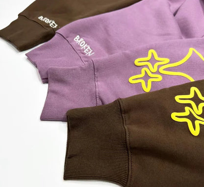 Trendha Two-Tone Hooded Sweatshirt with Star Print in Purple