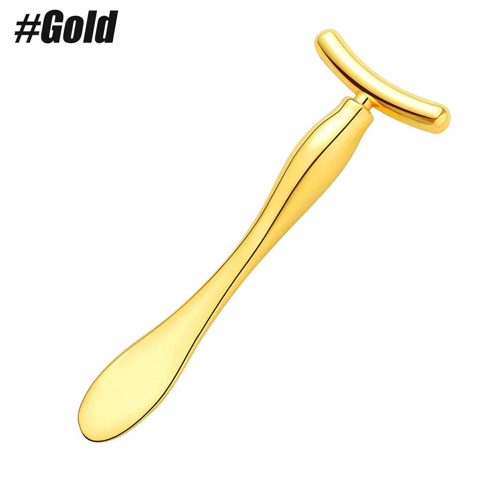 A rose gold metal eye cream applicator and face massager tool with a Y-shaped design for effective skincare application and facial massage