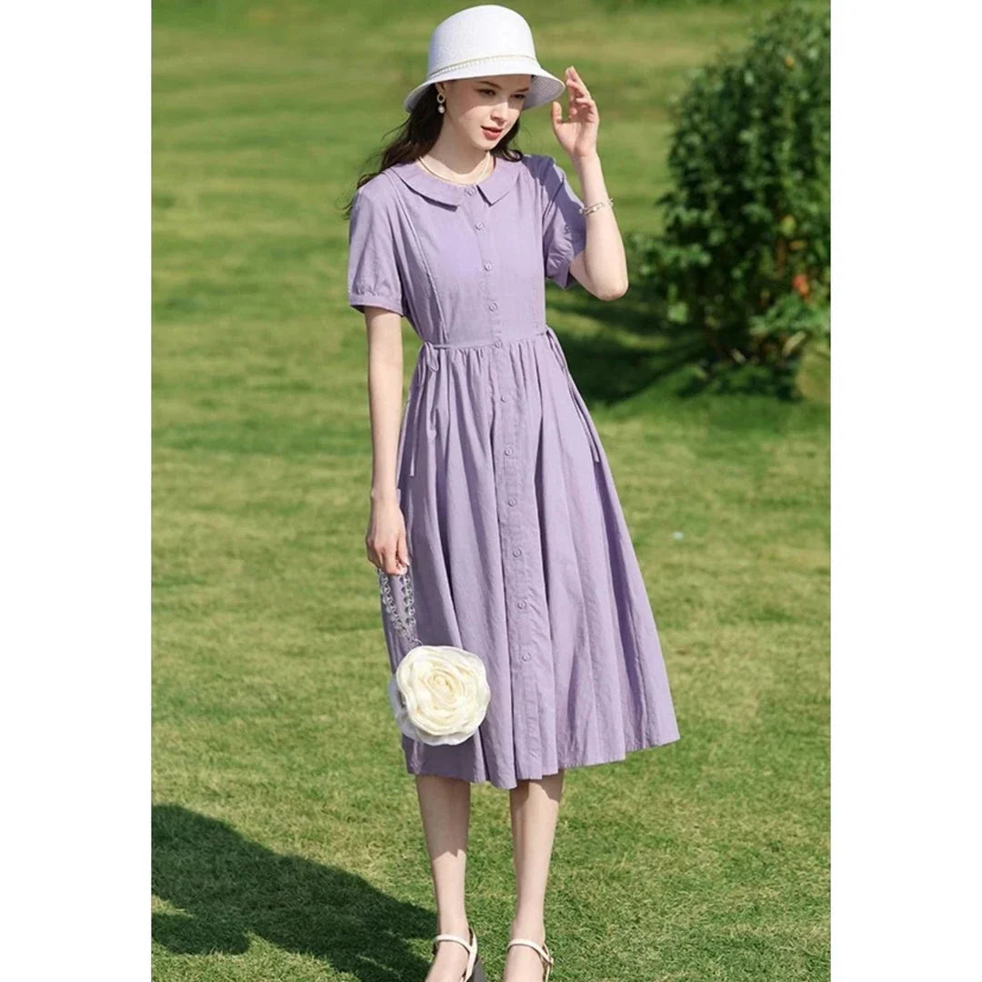 Sophisticated French-inspired short sleeve summer dress with puff sleeves, turn-down collar, and lace-up detailing