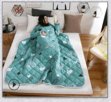 A cosy, wearable quilt with sleeves in a variety of colourful designs, perfect for staying warm and comfortable during the winter months.
