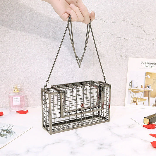 A sophisticated British-designed metal mesh clutch bag with a chain strap, available in various colours and chain styles