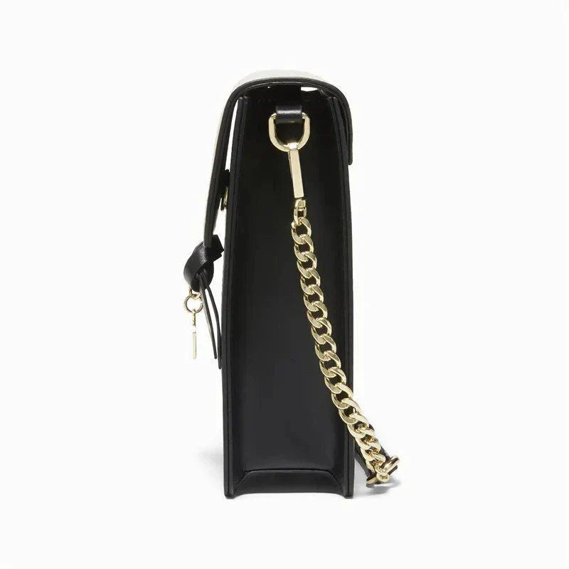 Stylish black leather crossbody phone bag with tassel accent, offering secure storage and versatile design for everyday use.