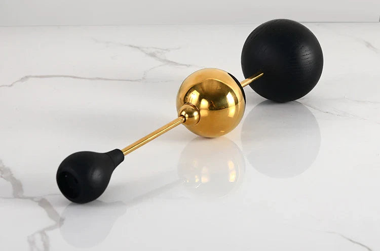 Elegant stainless steel and wooden candlestick set with a captivating design that creates a soothing ambience in any living space