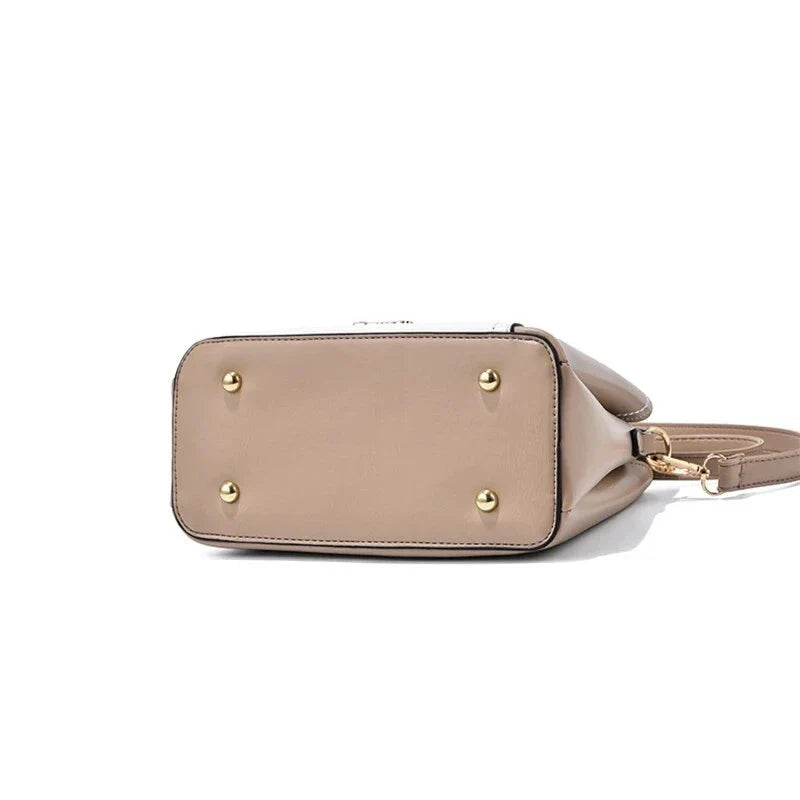 Sophisticated navy blue PU leather bucket crossbody bag with elegant patchwork design and adjustable strap