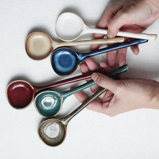 Elegant ceramic soup spoon with long handle and vibrant grey glaze, perfect for refined dining experiences