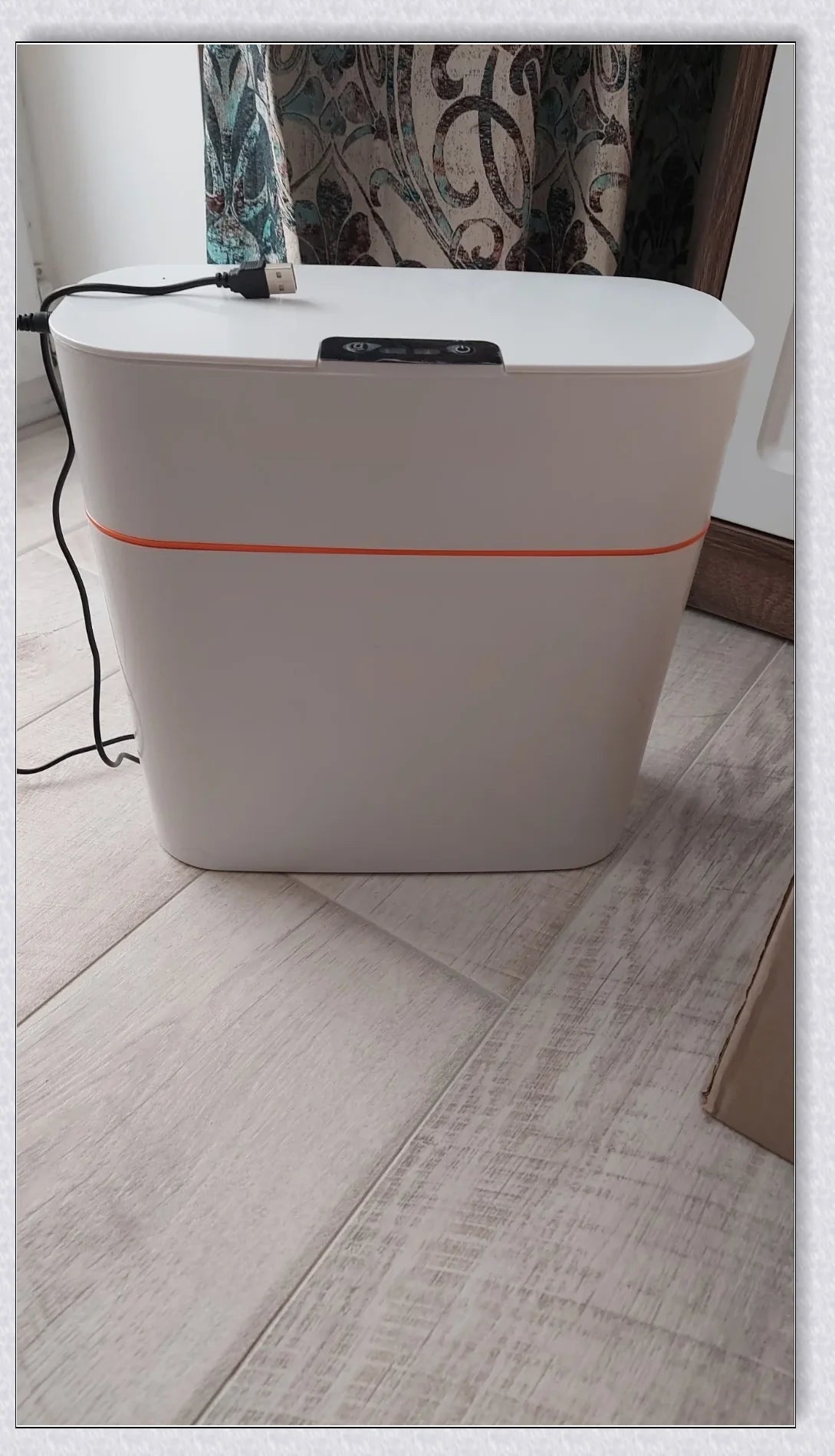 Sensor-powered bin with sleek design and touch-free motion-activated lid for effortless, hygienic waste disposal