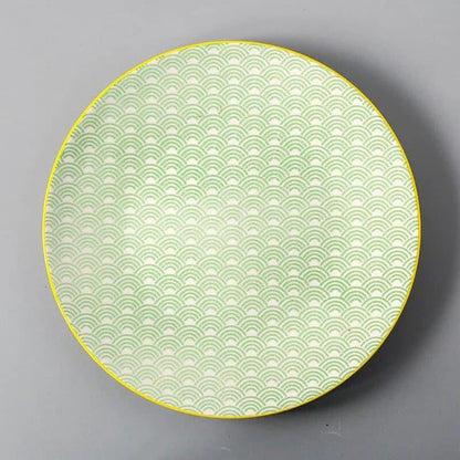 Elegant ceramic plates with vibrant, whimsical prints in a variety of enchanting designs