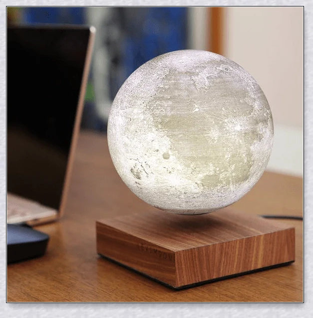 Lunamen Magnetic Levitating Moon Lamp with detailed lunar surface and floating above magnetic base