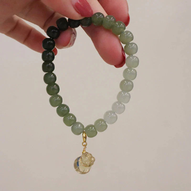 Elegant Hetian jade barrel bead bracelet with gradual colour transition, handcrafted with premium materials for a sophisticated style.