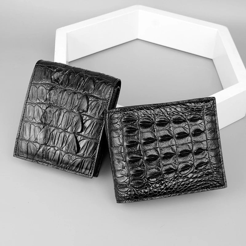 Sophisticated men's leather wallet in black, made from premium crocodile skin for a refined and durable everyday accessory