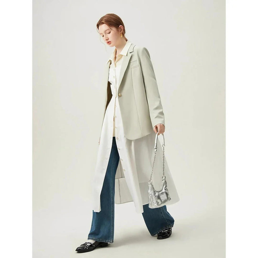 Elegant cotton and linen suspender dress with square collar neckline, A-line silhouette, and mid-calf length for a sophisticated and comfortable summer look.