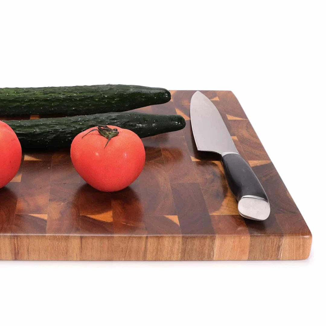 Premium Acacia wood chopping board with a convenient juice groove to catch liquids during food preparation
